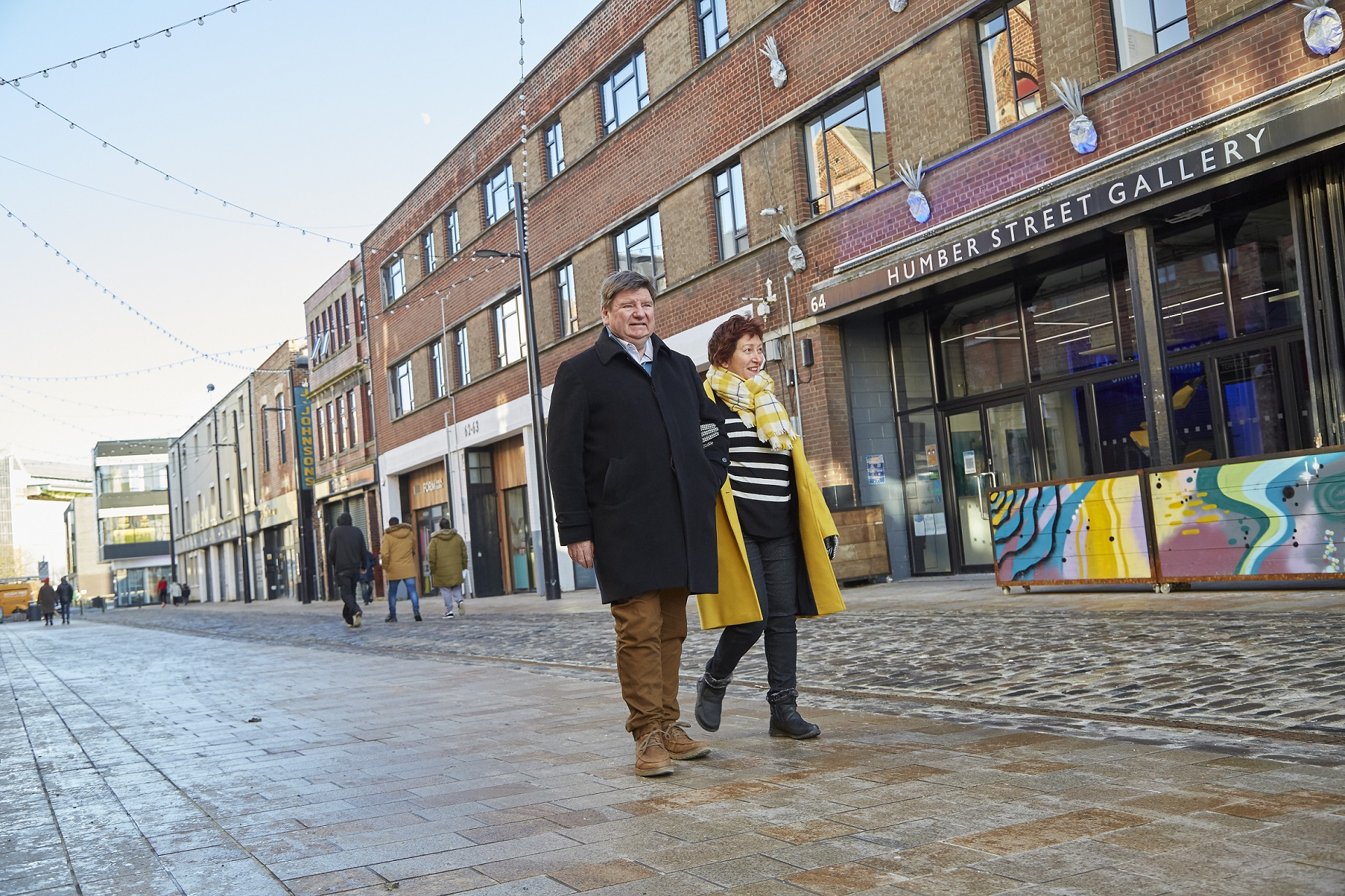 Deborah Morgan and Professor Trevor Burnard walk along Humber Street 