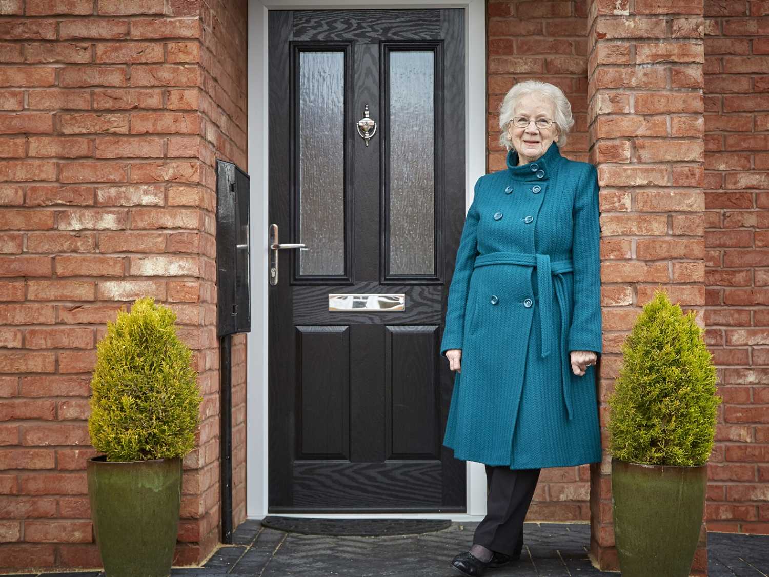 Sheila outside her Beal bungalow