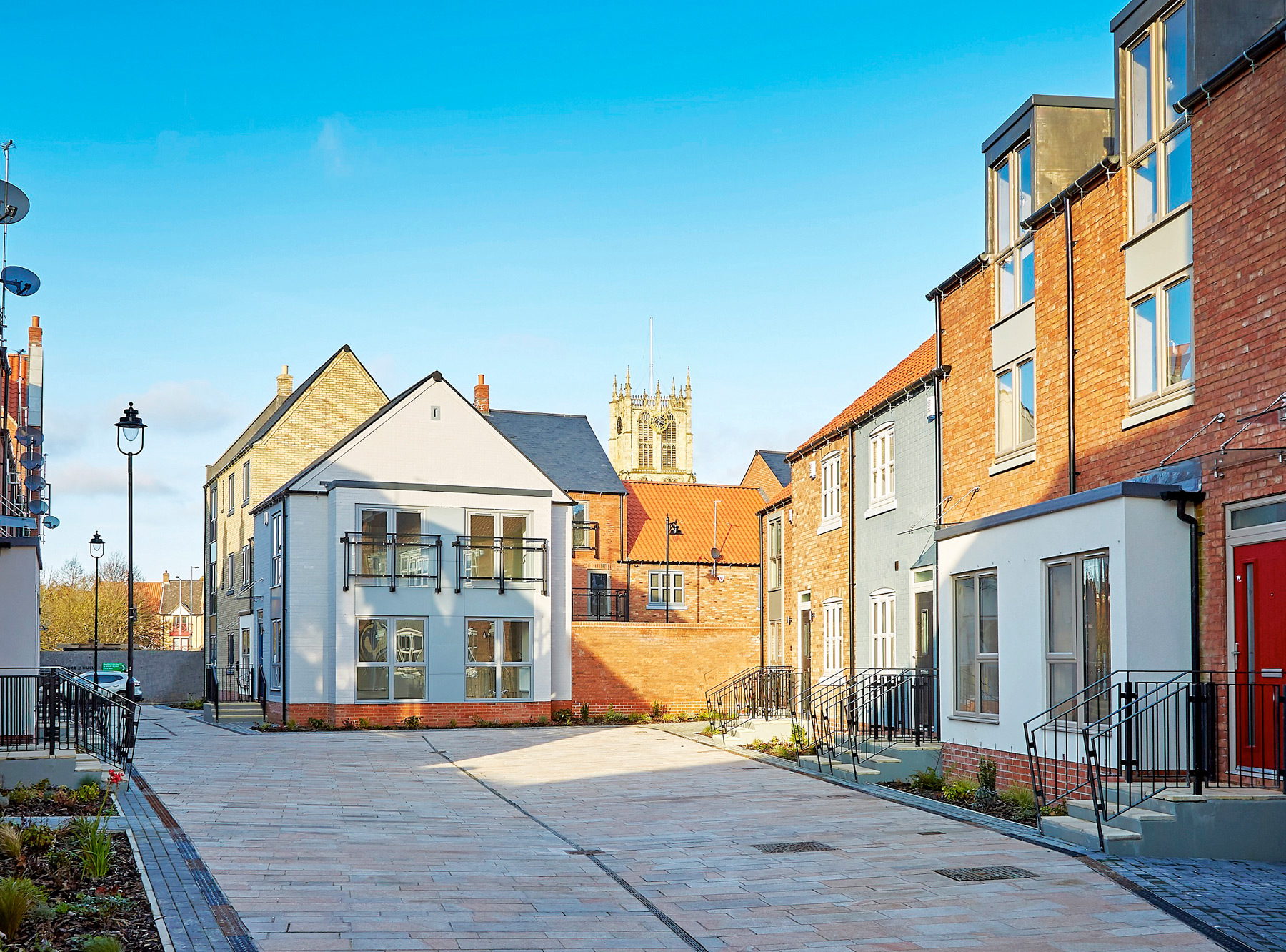 Attractive townhouses and cobbled paving make up Scott's Square