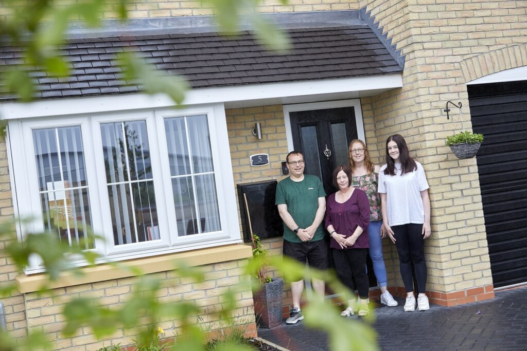 The Greenway family outside their new Beal home