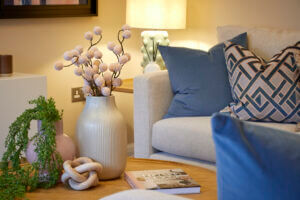beal homes living room interior design with cushions and flowers on the site table